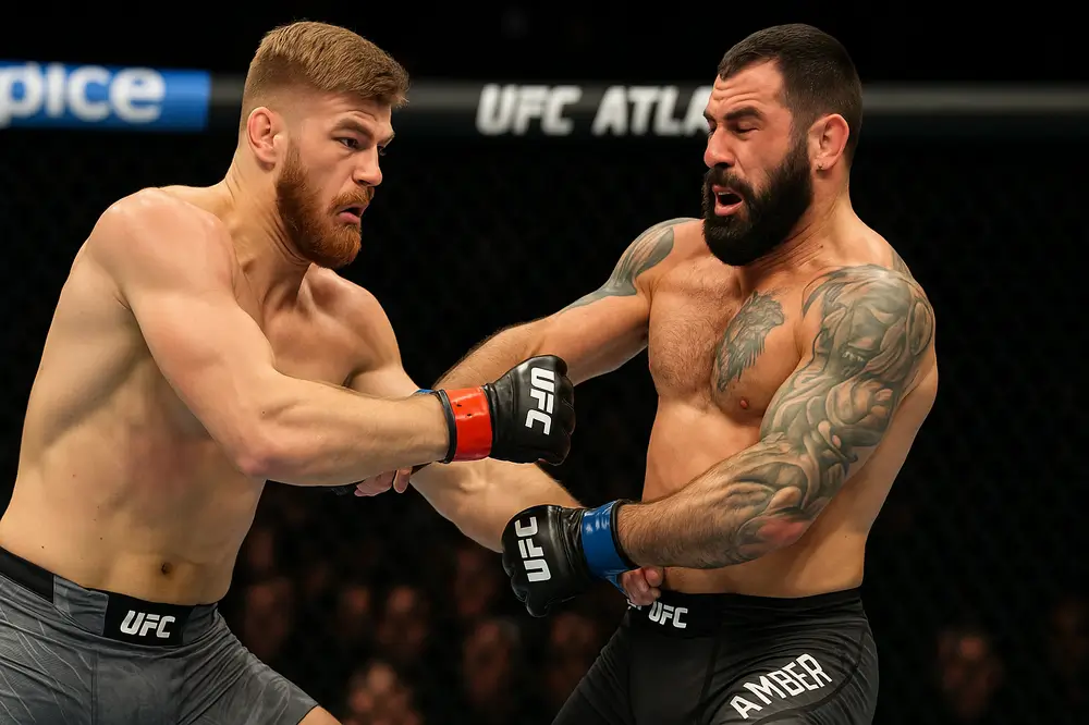 Эдмен Шахбазян атакует Андре Петроски мощным ударом в корпус на UFC Atlanta